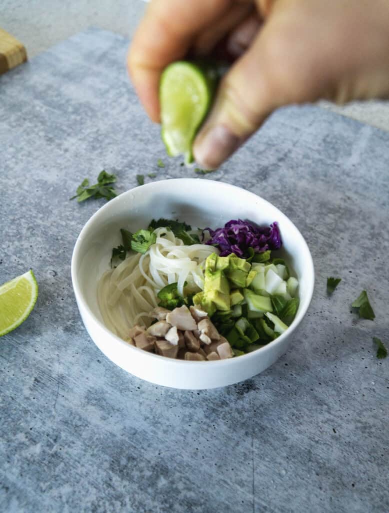 Squeezing lime into Pho