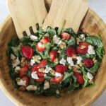 Strawberry Spinach Salad in wooden salad bowl
