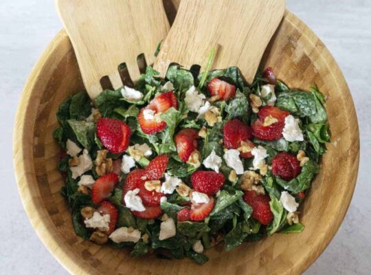 Strawberry Spinach Salad in wooden salad bowl