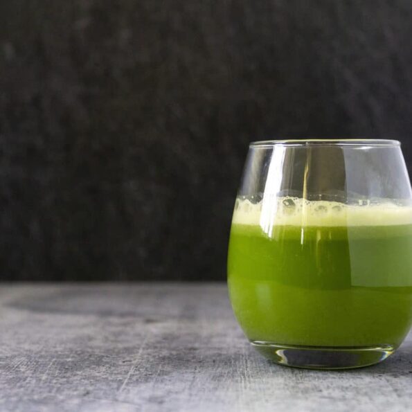 Foamy celery juice in a glass