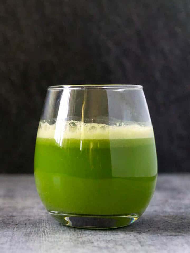 Foamy celery juice in a glass