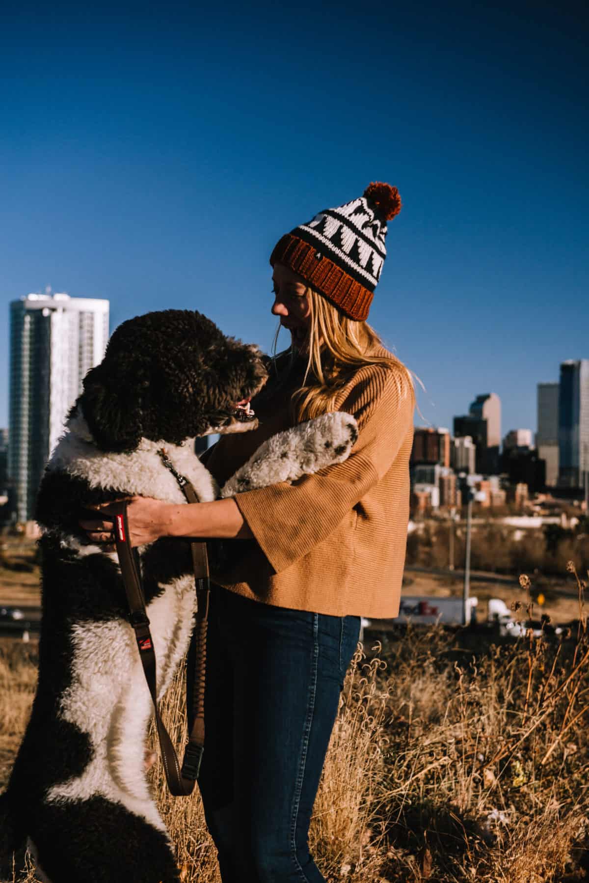 Alicia and Argus Blond girl with bernadoodle dog