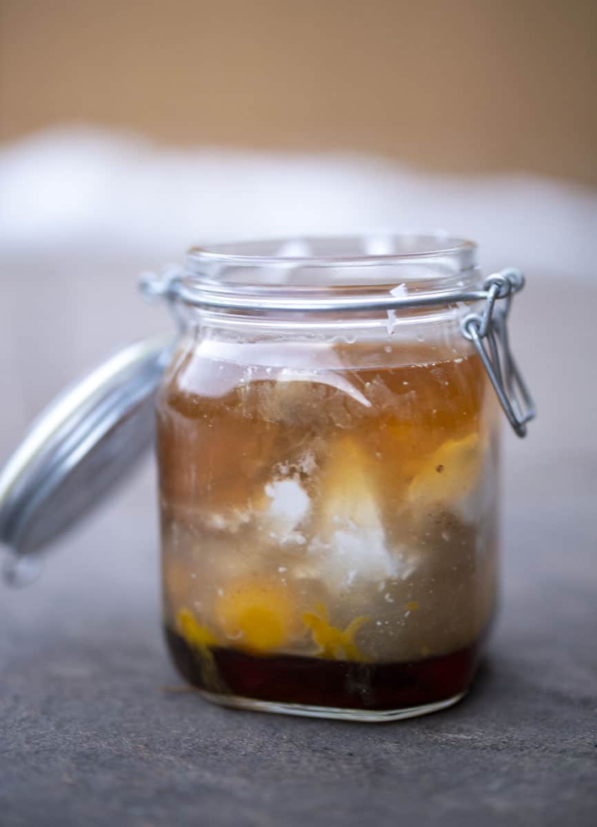 unmixed eggnog ingredients in a large mason jar